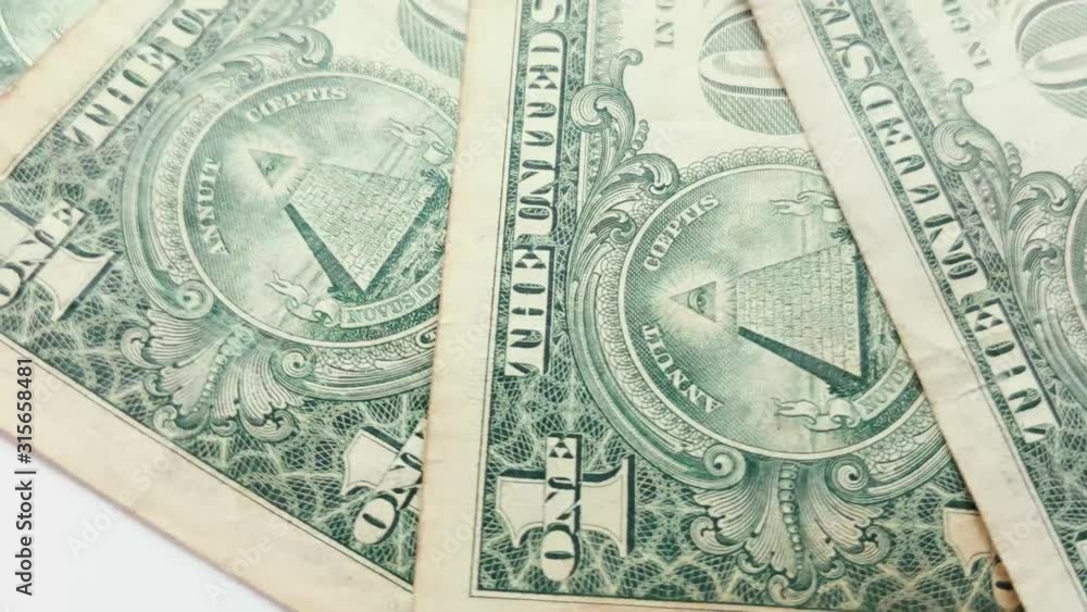 Several One Dollar banknotes rotating in the frame. Several One Dollar banknotes rotating in the frame.