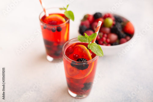 Fresh summer berry drink with lemon and mint.