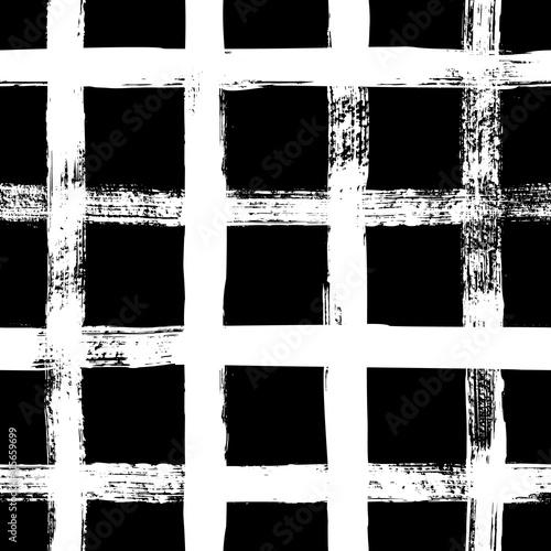 Grunge grid seamless pattern. Abstract plaid texture hand drawn with a ink brush strokes. Vector Monochrome background