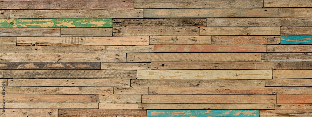 Wooden Background From Many Old Painted Boards In Different Colors. Panoramic Wide Multicolored Rough Texture. Woodern Banner. - obrazy, fototapety, plakaty 