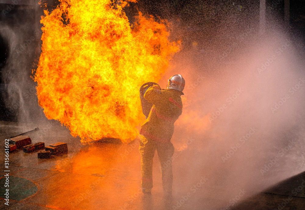 The Firefighters demonstrating fire fighting.