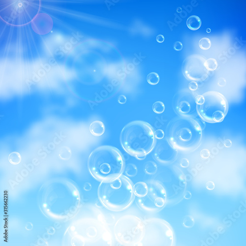 Realistic transparent floating soap bubbles on blue sky background. Design element for advertising booklet, flyer or poster