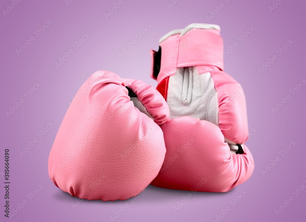 Sports pink boxing gloves on pastel background