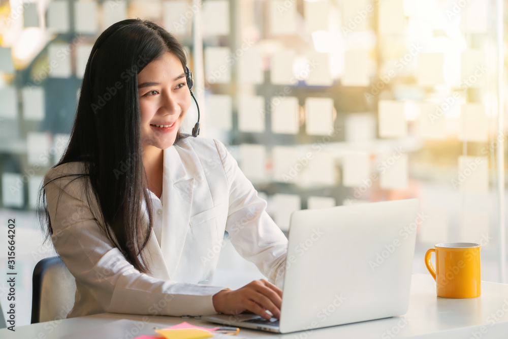 Young female customer support phone operator with headset working in call center. Young female customer support phone operator with headset working in call center.