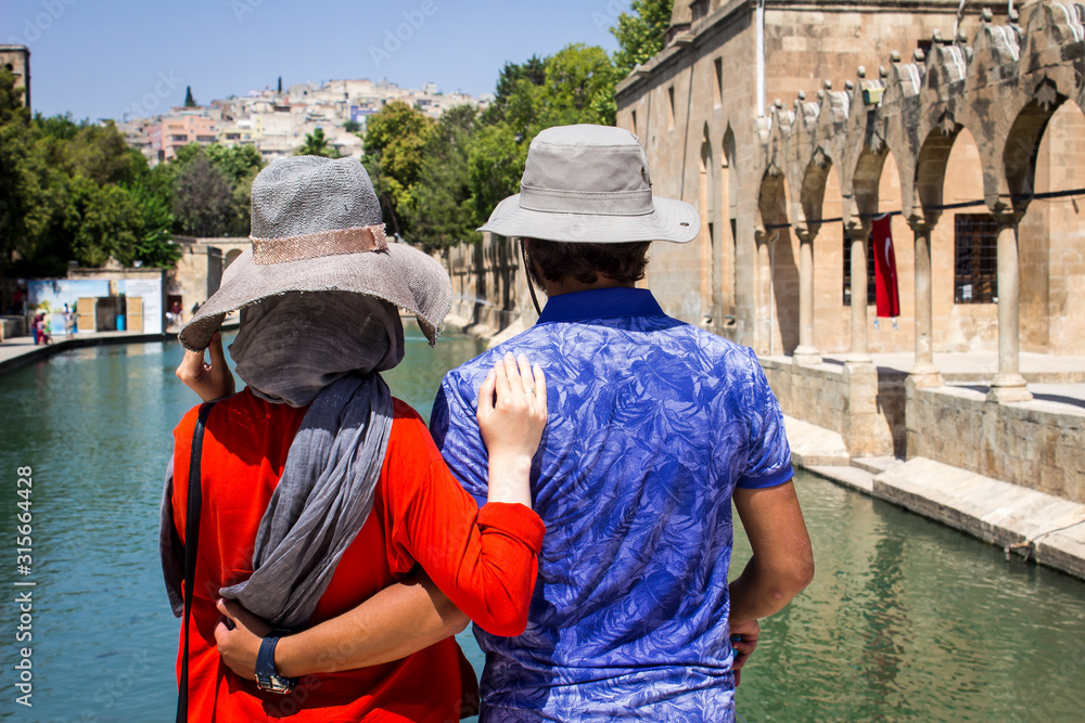 Sanliurfa, Chemical hat in front of two tourists holding each other dear,