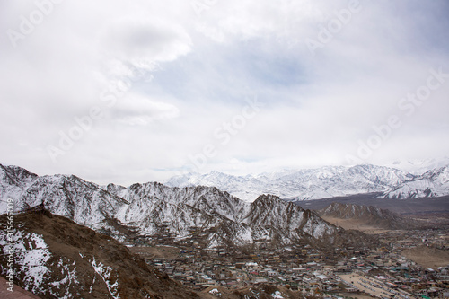 View landscape and cityscape of Leh Ladakh Village with high mountain range from viewpoint Tsemo Maitreya Temple or Namgyal Tsemo Monastery while winter season in Jammu and Kashmir, India