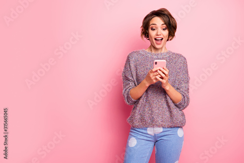 Portrait of her she nice attractive lovely pretty winsome charming cute cheerful cheery glad brown-haired girl using cell fast speed connection isolated over pink pastel color background photo