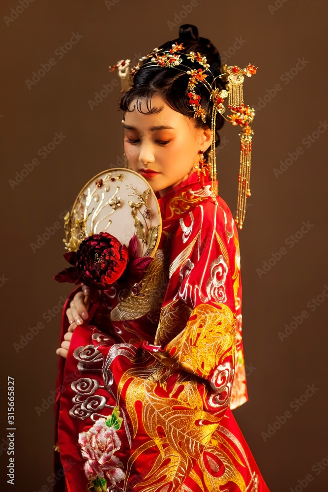 Asian girl in red chinese traditional costume Asian girl in red chinese traditional costume