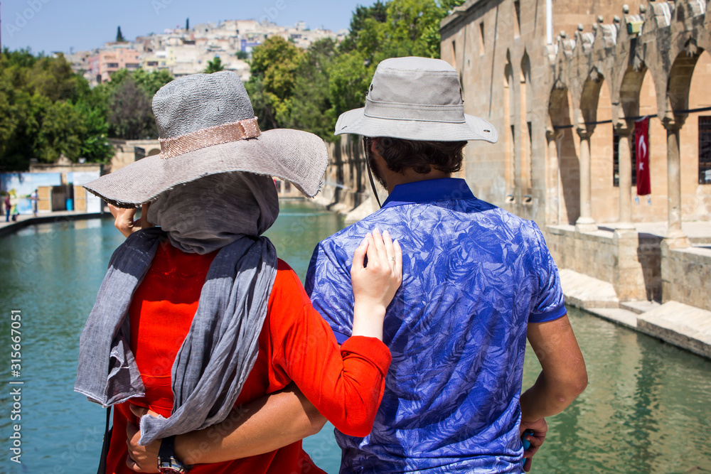 Sanliurfa, Chemical hat in front of two tourists holding each other dear,