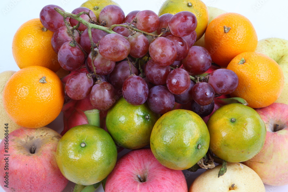 Close up of heap of fruit, isolated. Concept of healthy eating and dieting lifestyle Close up of heap of fruit, isolated. Concept of healthy eating and dieting lifestyle