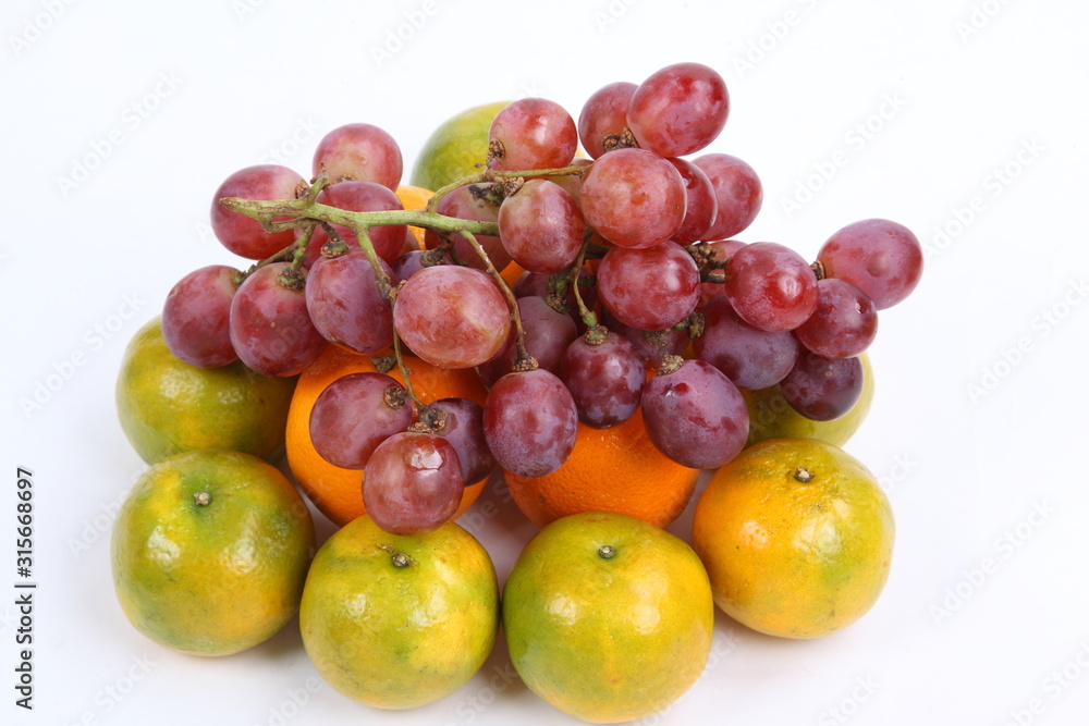 Close up of heap of fruit, isolated. Concept of healthy eating and dieting lifestyle 