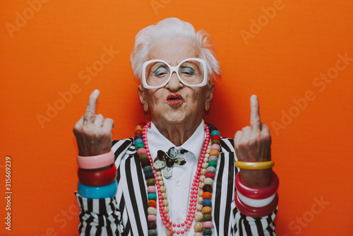 Funny grandmother portraits. Senior old woman dressing elegant for a special ...