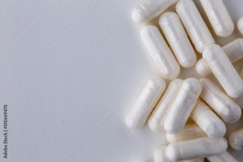 Pills tablets vitamins drugs white close up macro shot Pills tablets vitamins drugs white close up macro shot
