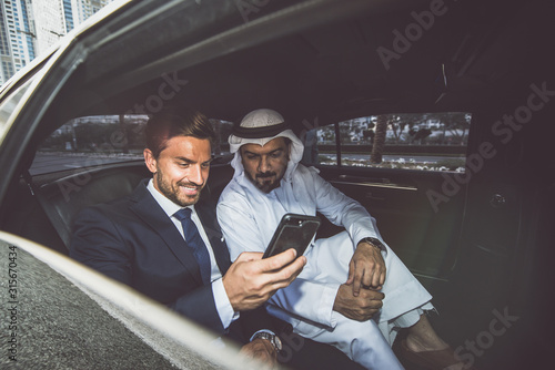 Canvas Print Business team talking about future plans in Dubai in the limousine