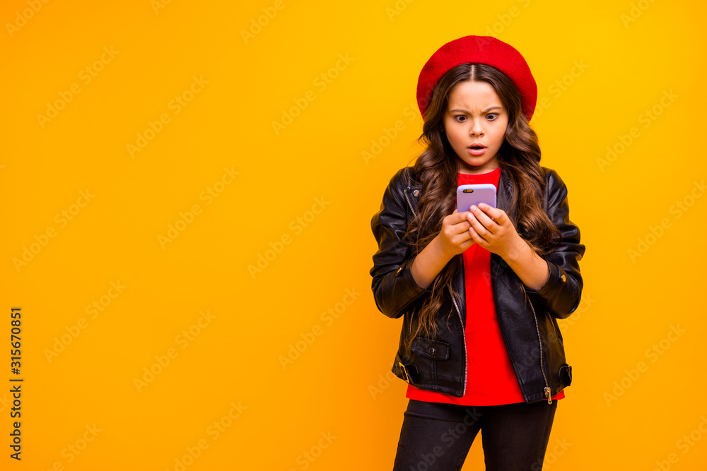 Portrait of her she nice attractive pretty lovely worried long-haired girl wearing streetstyle using cell browsing fake news isolated over bright vivid shine vibrant yellow color background Portrait of her she nice attractive pretty lovely worried long-haired girl wearing streetstyle using cell browsing fake news isolated over bright vivid shine vibrant yellow color background