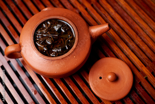 Brewed tea leaves in a teapot.