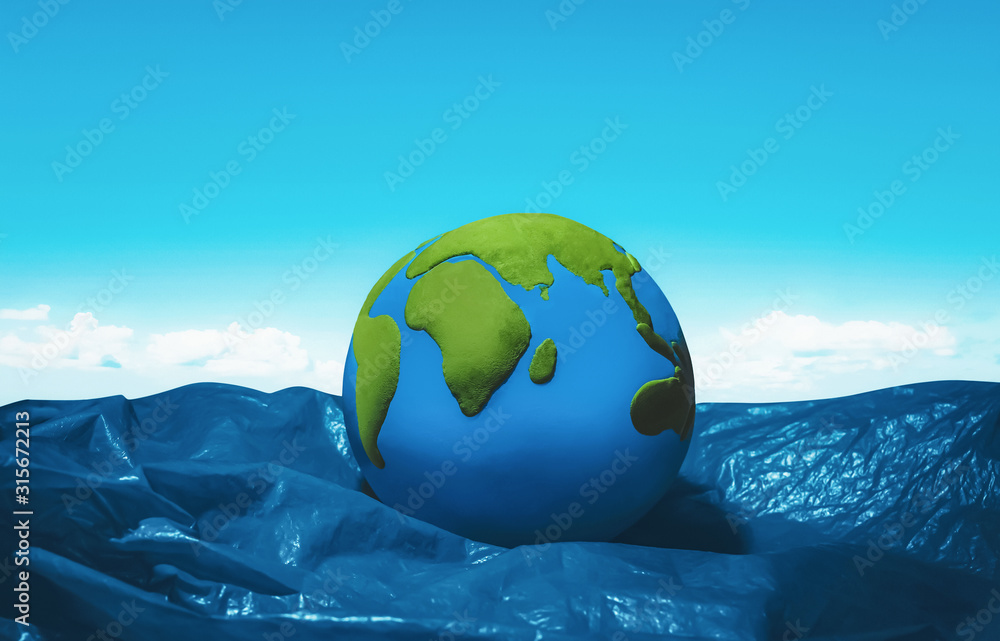 earth floating on blue plastic ocean - obrazy, fototapety, plakaty 