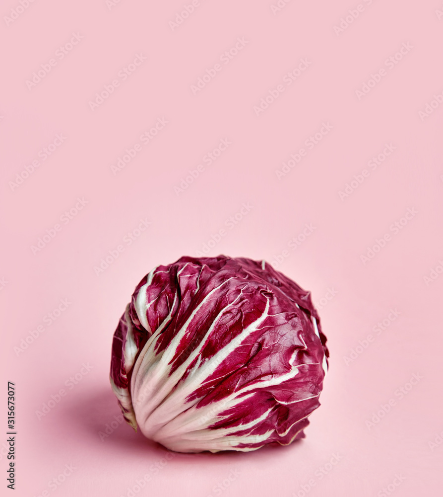 Fototapeta premium Radicchio salad isoalted on colored background. Radicio salad