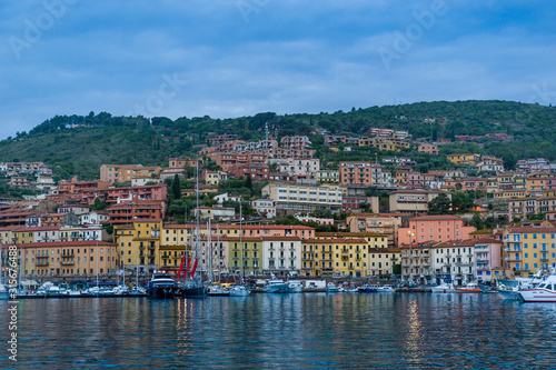 Porto Santo Stefano old town view from the water at early norning light. Toscana, Italy photo