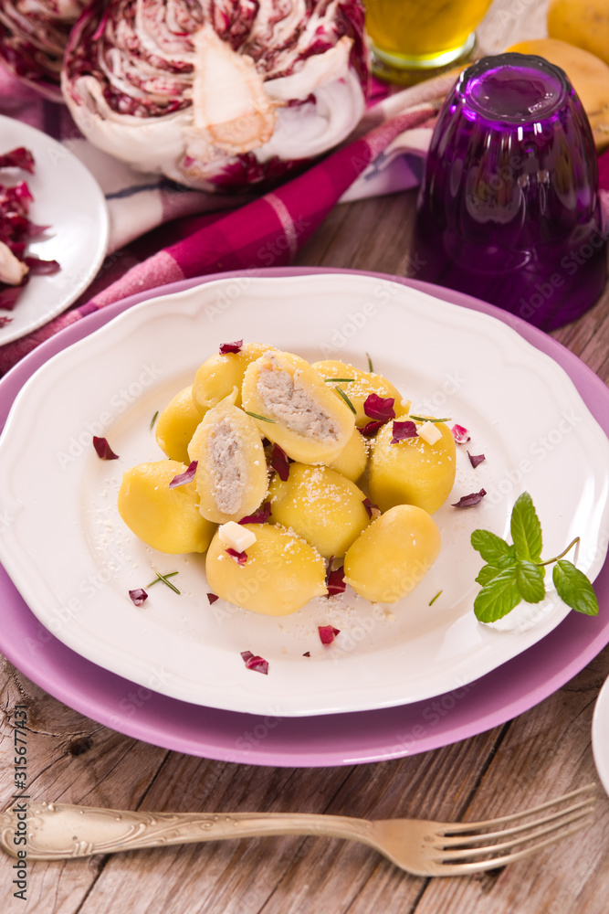 Potato gnocchi stuffed with radicchio and ricotta.