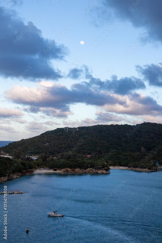 Haiti peninsula with day moon and sunset clouds Haiti peninsula with day moon and sunset clouds
