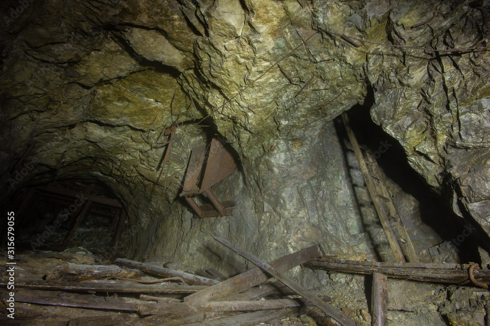 Old underground gold mine shaft tunnel with orechute Old underground gold mine shaft tunnel with orechute