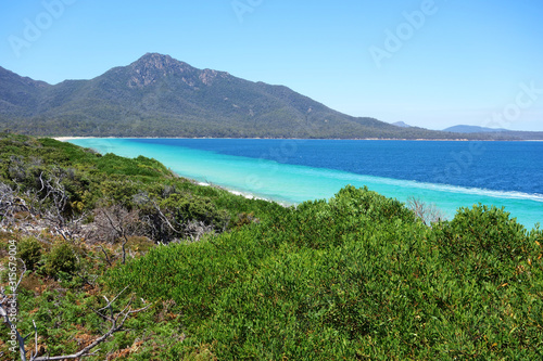View over turquoise waters of Hazard Beach  next to Wineglass Bay   Freycinet National Park  Tasmania  Australia