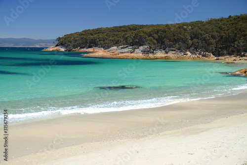 View over turquoise waters of Hazard Beach (next to Wineglass Bay), Freycinet National Park, Tasmania, Australia