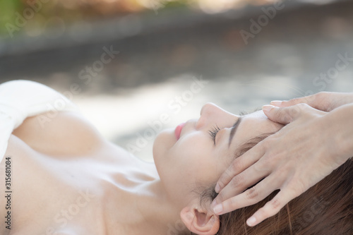 Beautiful, young and healthy woman in spa massage