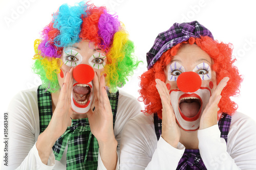 Fototapeta Women dressed in clown costume for carnival are silly and funny