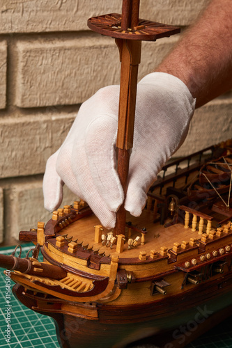 Фотография Installation of the foremast on the ship model