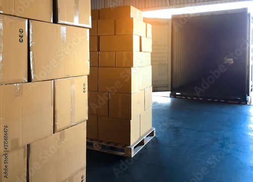 Stack package boxes on pallet load into a truck, Freight industry logistics and transport, Cargo shipment, Warehouse courier transport by truck