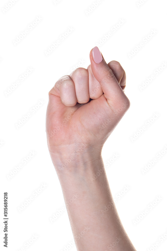 Female hand with fingers folded into fist isolated on white background. Female hand with fingers folded into fist isolated on white background.
