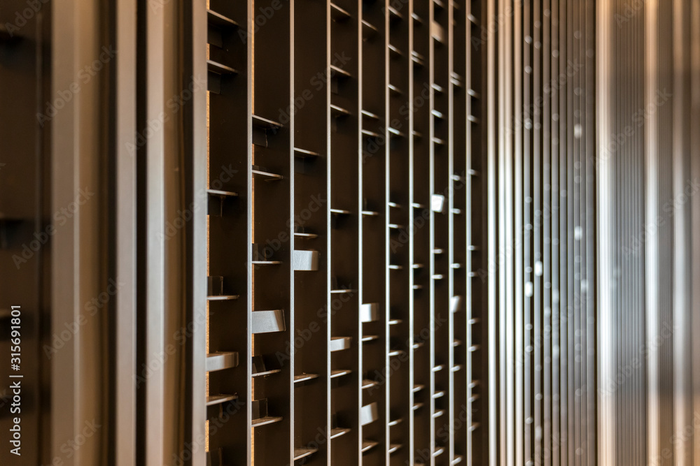 Random battens steel and pole are set in front of hotel wallpaper for backdrop and background. Random battens steel and pole are set in front of hotel wallpaper for backdrop and background.