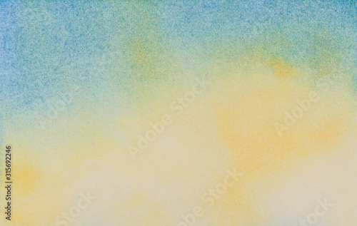 Watercolor abstract blue and yellow sky background. Hand drawn watercolor painting..