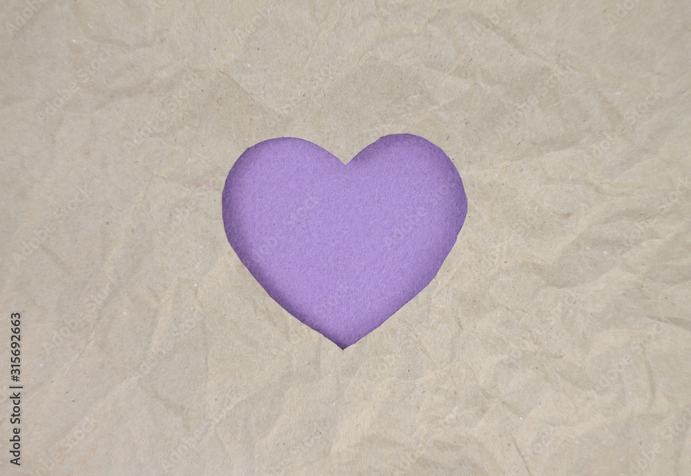Violet felt heart on craft paper. Crumpled paper texture. Valentine's day stock photo for web, print and wallpaper.With empty space for text. Violet felt heart on craft paper. Crumpled paper texture. Valentine's day stock photo for web, print and wallpaper.With empty space for text.