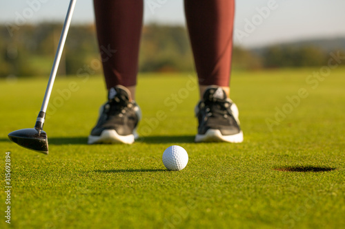 Professional woman golf player playing golf competition, match, professional