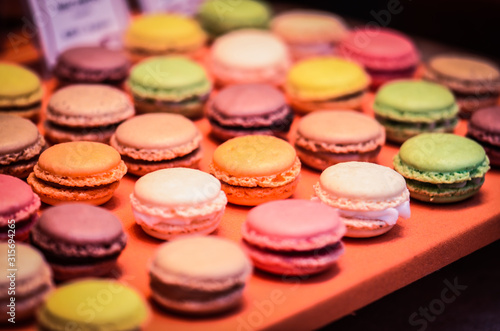 mix french macaroons close up view with different flavours & colours