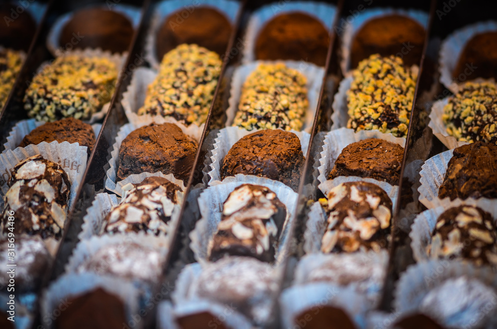 Fototapeta premium traditional belgian sweets - mix chocolate candies close up