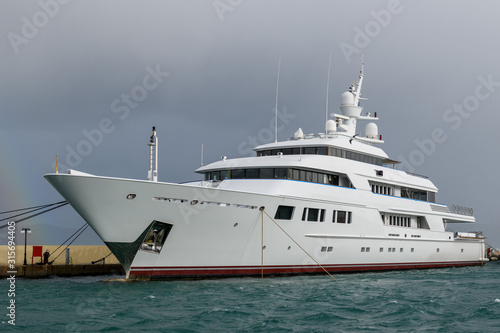 White luxury super yacht moored in marina. © Alexey Seafarer