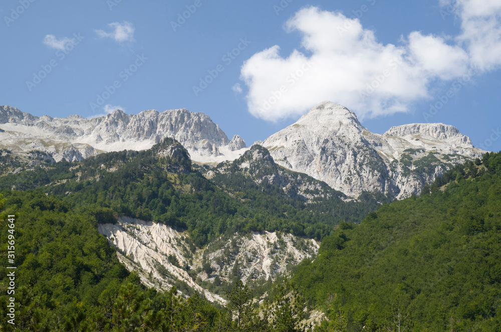 View of summits in Albanian Alps from Valbona valley in Valbona Valley National Park View of summits in Albanian Alps from Valbona valley in Valbona Valley National Park