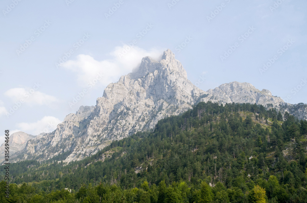 View of summit Maja e Thatë in Albanian Alps from Valbona villa