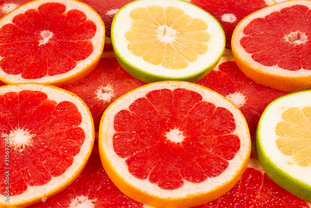Pomelo and grapefruit slices background. Pomelo and grapefruit slices background.