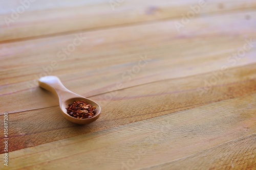 A spoon of cayenne pepper o...