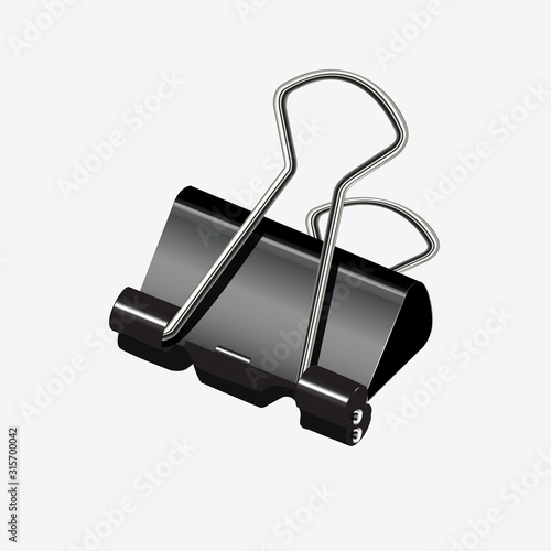 Black paper binder on a white background. Clerical clip or stapler.