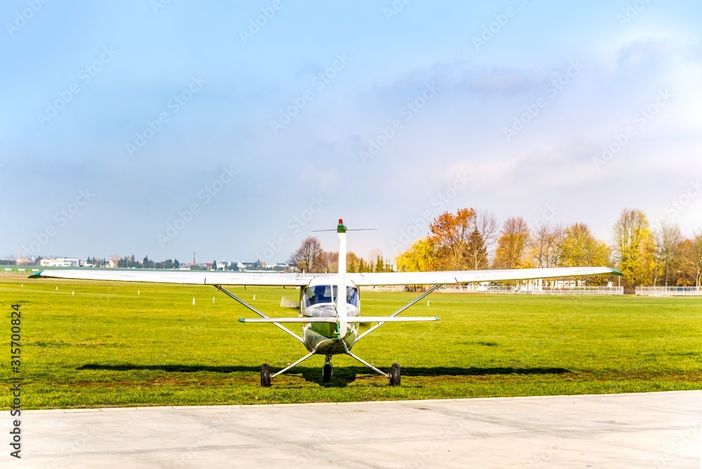 Fototapeta premium Small aircraft on runway . take-off of the plane