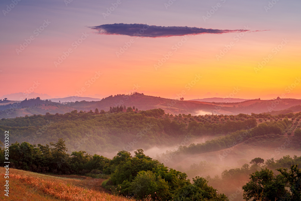 Beautiful sunrise in the Tuscany hills. Travel destination Tuscany