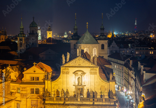 Prague - The Old Town from east tower of Charles bridge with the Klementinum - St. Salvator church at night