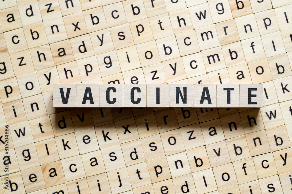 Obraz premium Vaccinate word concept on cubes