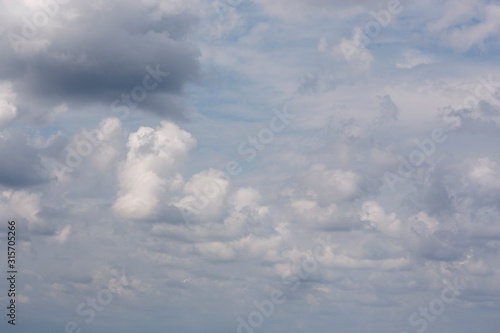 Fototapeta Naklejka Na Ścianę i Meble -  The blue sky with clouds as the blue backdrop in the air.